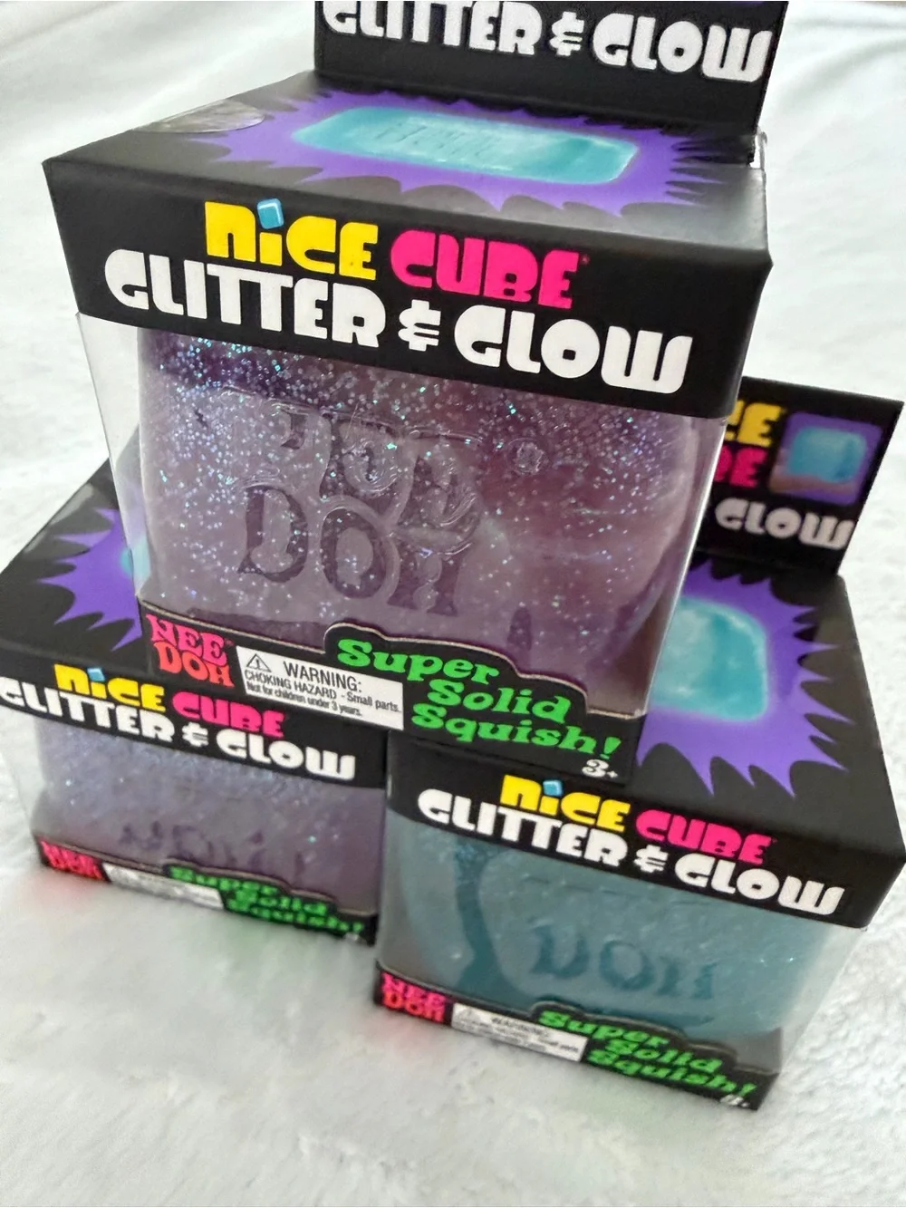 Set of Needoh Nice Cube Glitter & Glow Squishy Toys - Purple and Blue